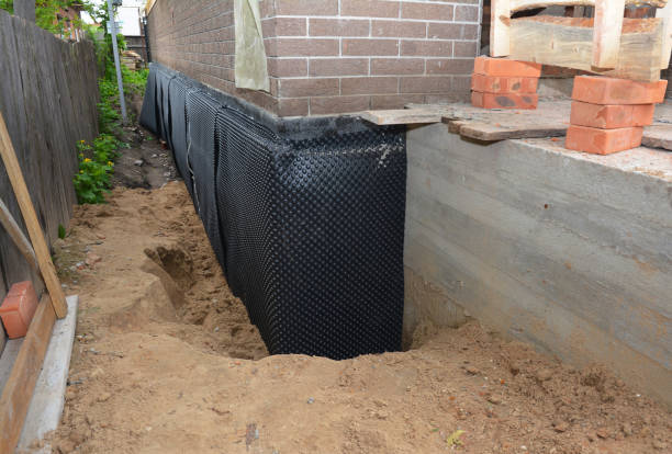 SJ Waterproofing Pros technician performing targeted Waterproofing assessment in Paris, IL